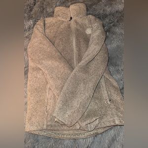 Women’s size medium fuzzy north face zip up